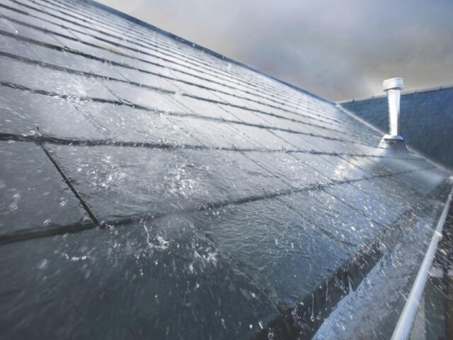 Heavy rain on a roof.