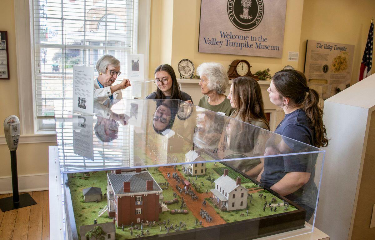 Rebecca Huffman shows community members some of the exhibits in the Hardesty-Higgins Visitor Center.