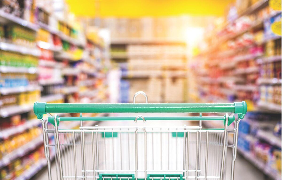 Grocery store cart in an aisle