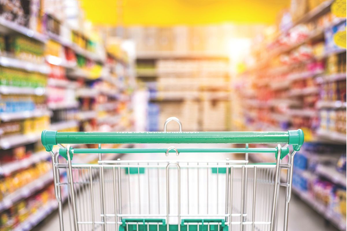 Grocery store cart in an aisle