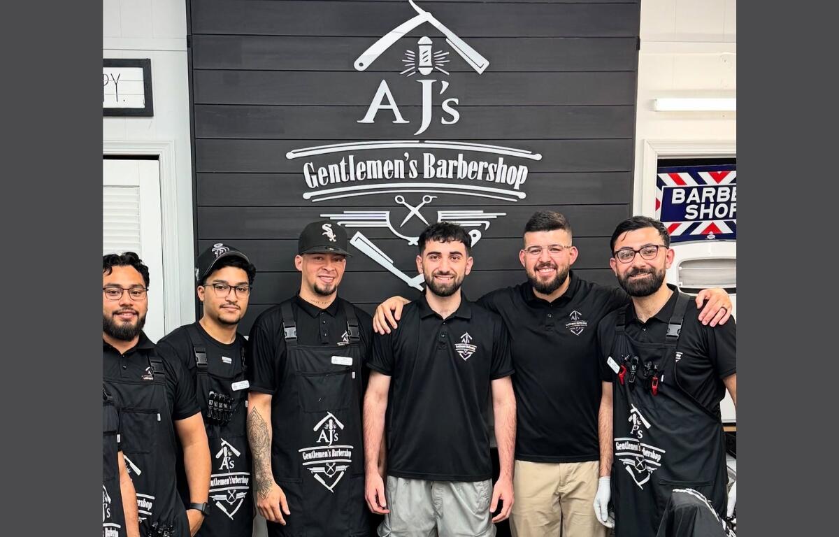 Staff photo of AJ's Gentleman Barbershop.