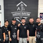 Staff photo of AJ's Gentleman Barbershop.