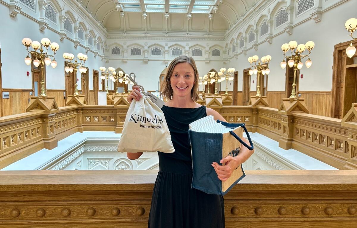 Amanda DePoy holding a gift bag.