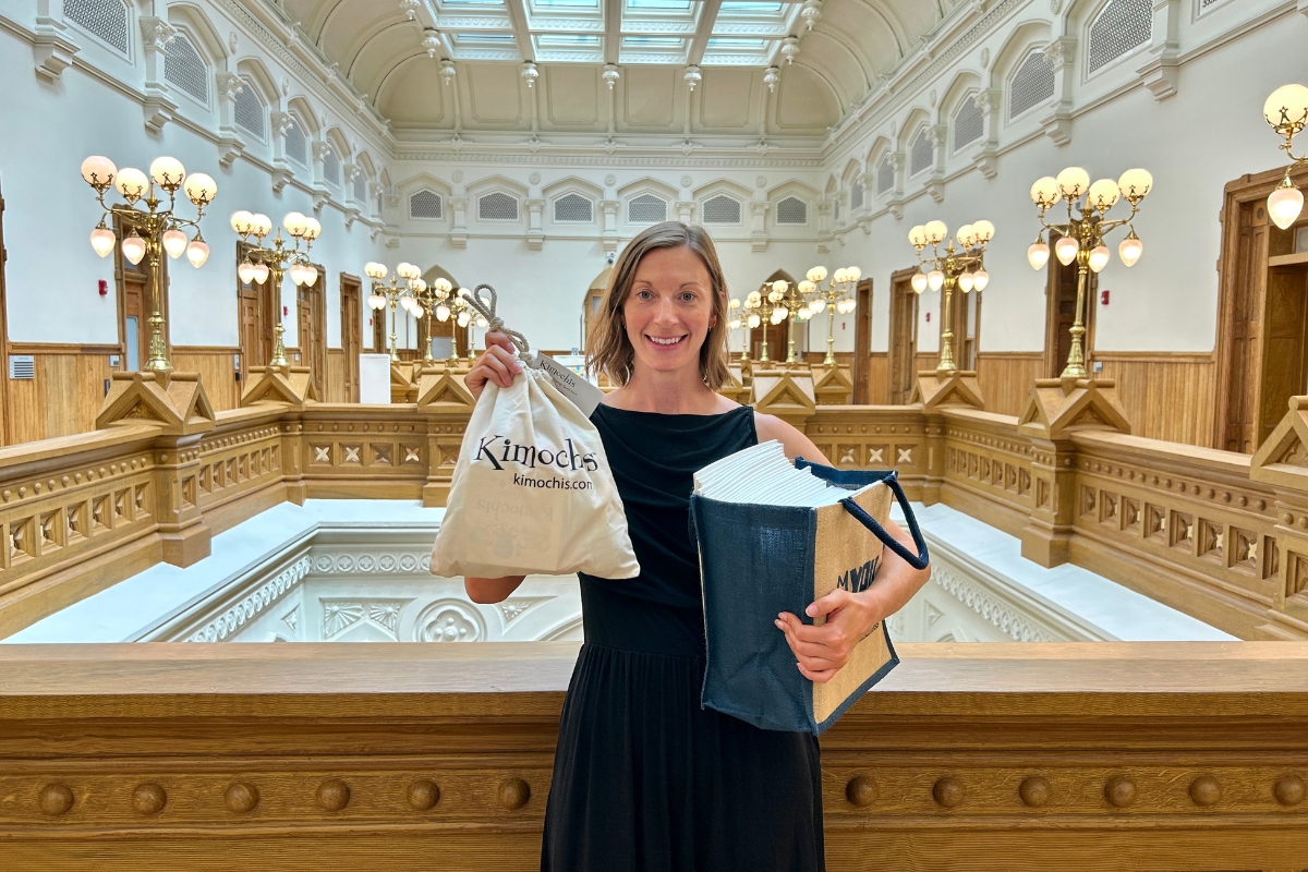 Amanda DePoy holding a gift bag.