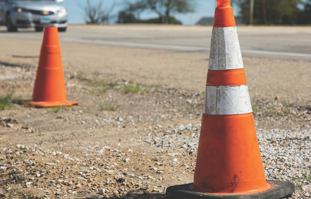 Traffic cones on the side of the road.