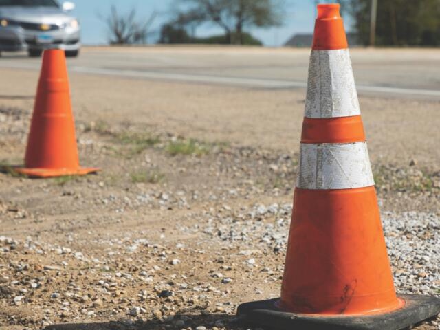 Traffic cones on the side of the road.