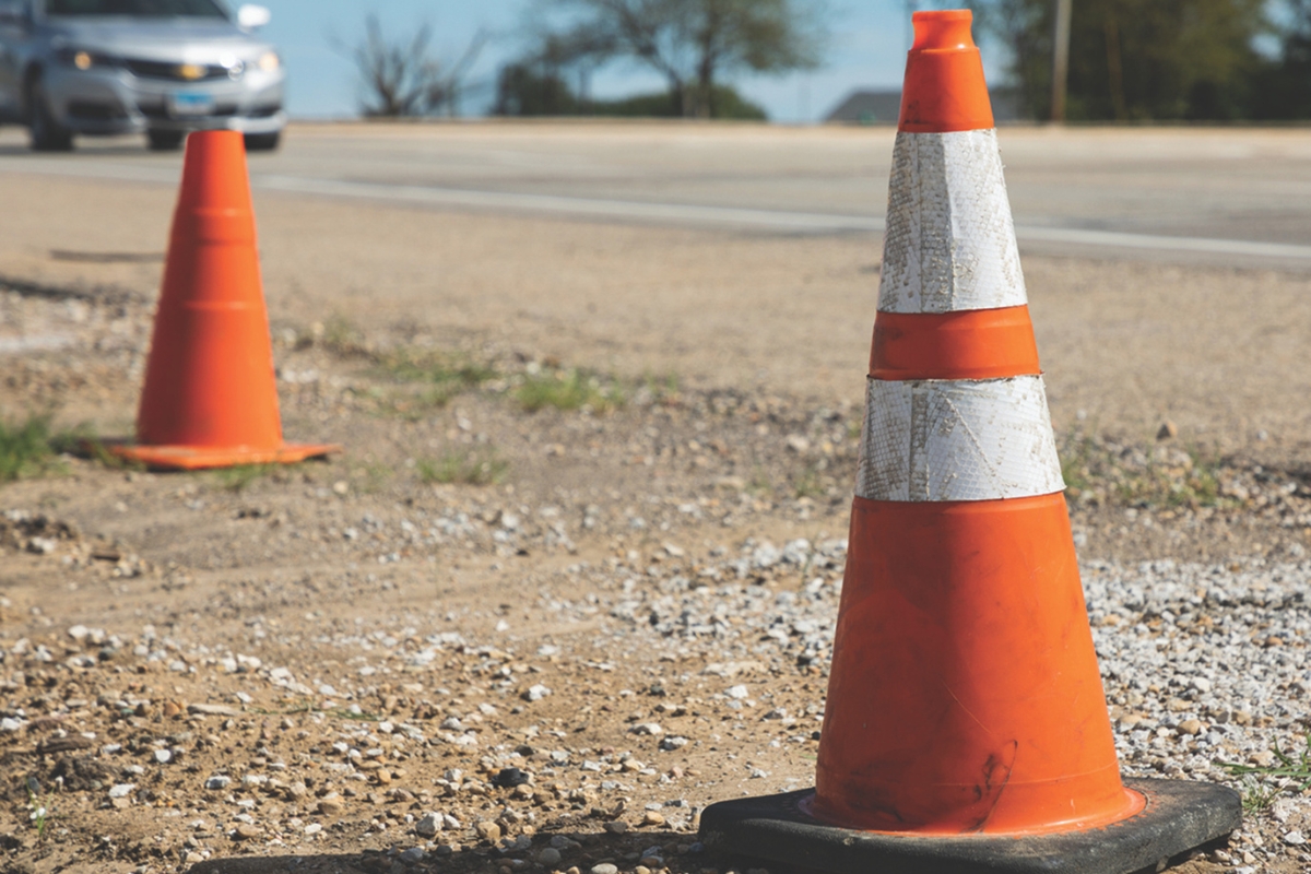 Traffic cones on the side of the road.