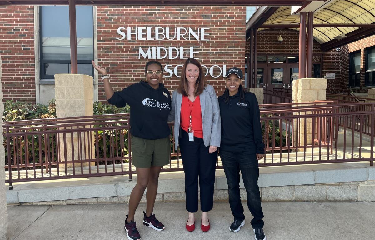 On the Road officials with Shelburne Middle School Principal Lisa Warren.