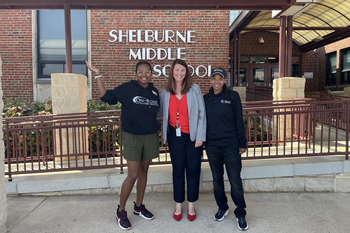 On the Road officials with Shelburne Middle School Principal Lisa Warren.