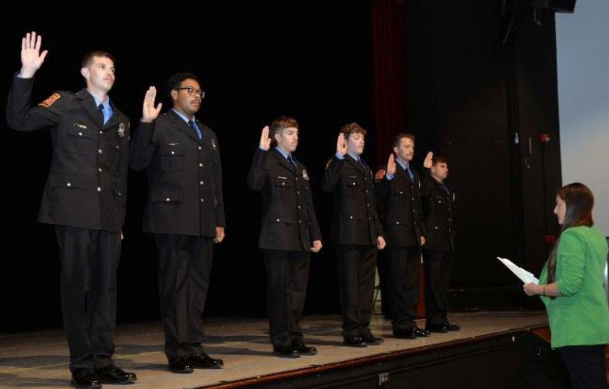 Assistant Chief Deputy Clerk of Rockingham County Court Alena Almeida delivers the Oath of Office to new HFD firefighters