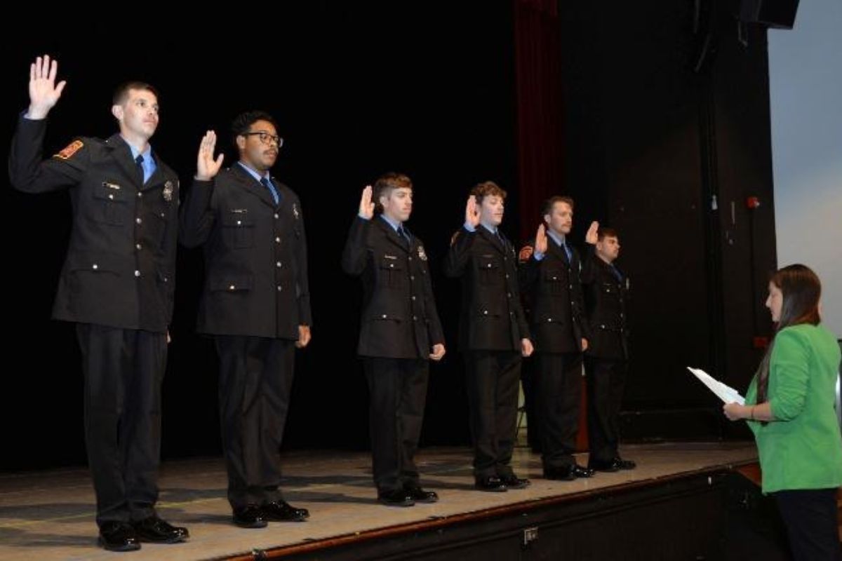 Assistant Chief Deputy Clerk of Rockingham County Court Alena Almeida delivers the Oath of Office to new HFD firefighters