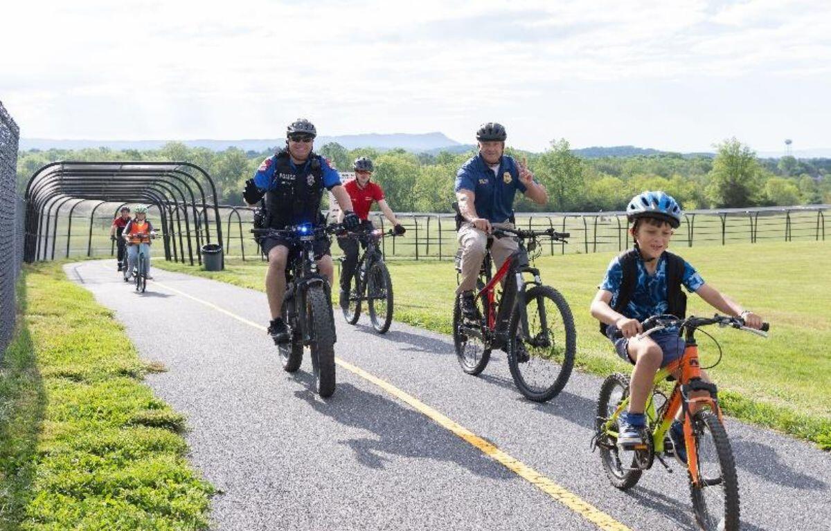 Students, teachers and community members bike to school on The Friendly City Trail to celebrate Bike and Roll to School Day in 2025. This year’s event will take place on Wednesday, Oct. 8.