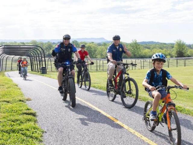 Students, teachers and community members bike to school on The Friendly City Trail to celebrate Bike and Roll to School Day in 2025. This year’s event will take place on Wednesday, Oct. 8.