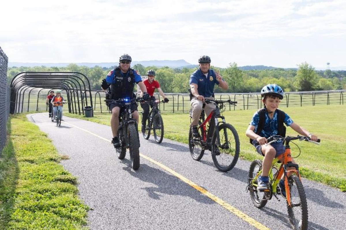 Students, teachers and community members bike to school on The Friendly City Trail to celebrate Bike and Roll to School Day in 2025. This year’s event will take place on Wednesday, Oct. 8.