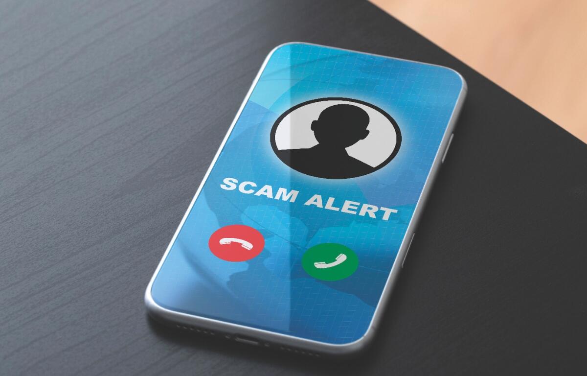 A prompt on a phone that says scam alert.