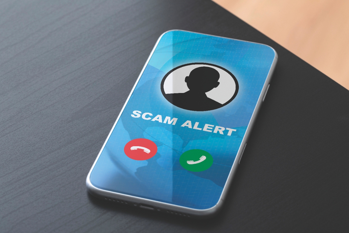 A prompt on a phone that says scam alert.