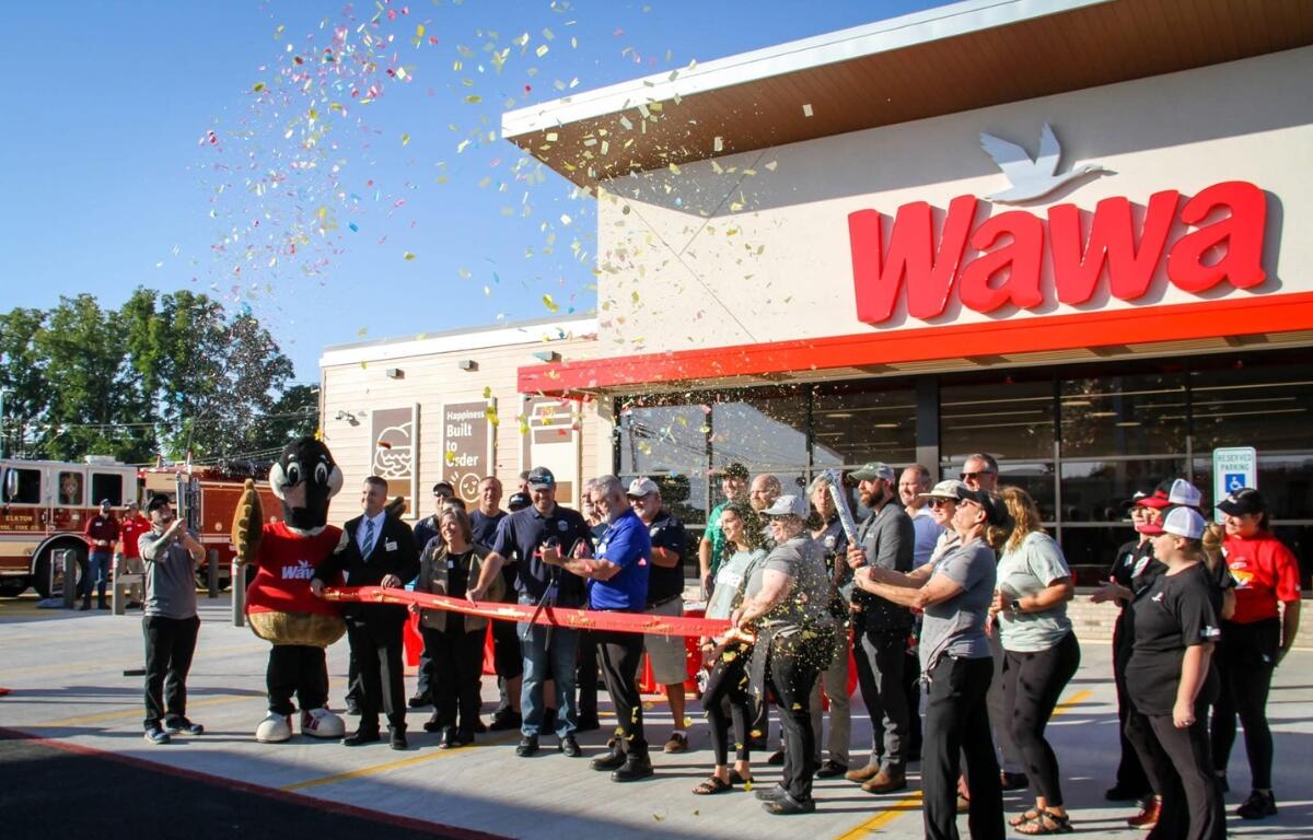 Confetti flies in front of the new Elkton Wawa location.