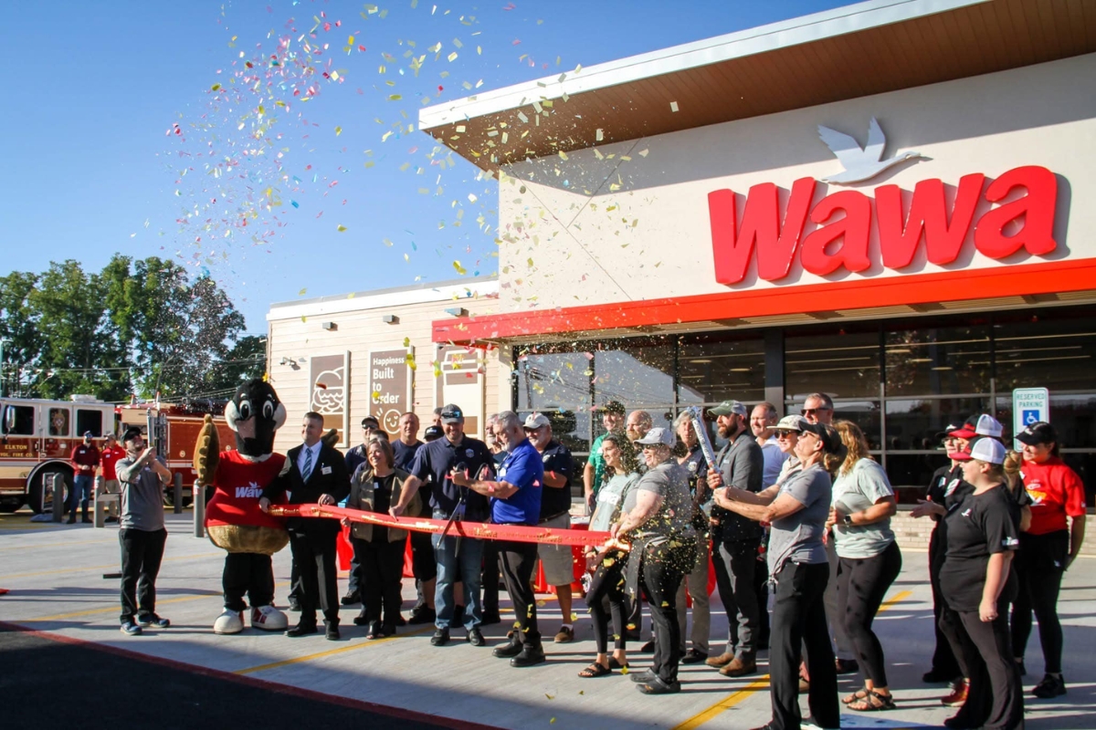 Confetti flies in front of the new Elkton Wawa location.