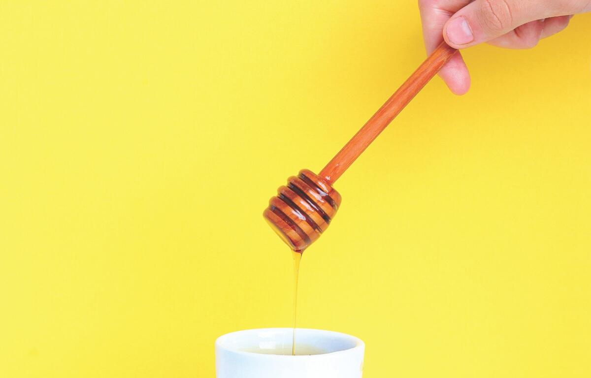 Up close of honey in a jar.