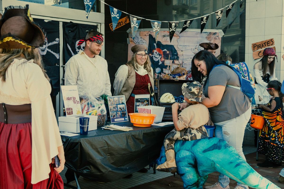 2024 Skeleton Festival attendees visiting a local downtown business for trick-or-treating
