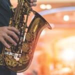 Musician playing saxophone on stage