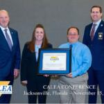 (From left) CALEA Executive Director Craig Hartley, HRECC Accreditation Manager April Corbin, HRECC Interim Director Ben Zimmerman and CALEA President Matthew Packard at this year’s CALEA conference. H