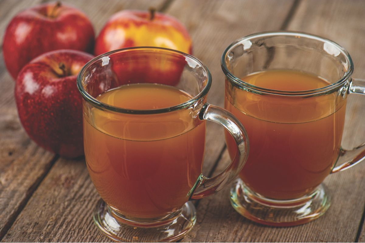 Glasses of cider with apples