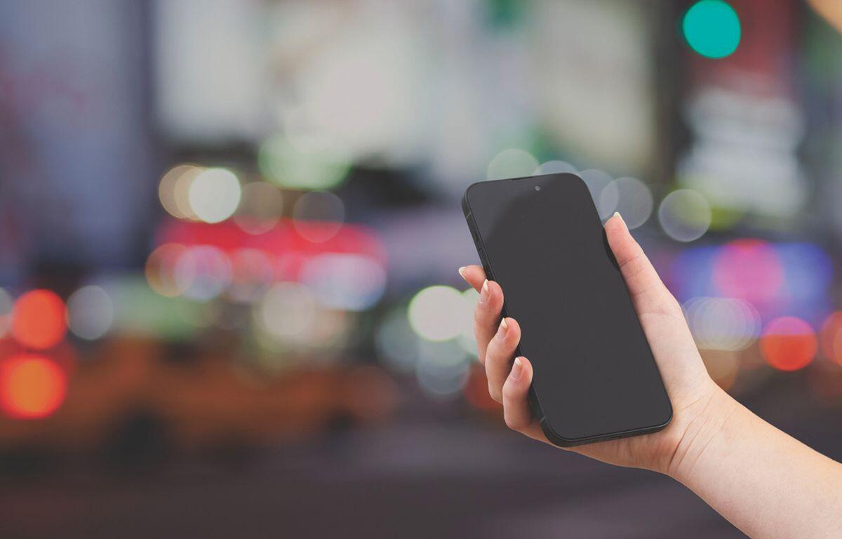 Person holding a cell phone