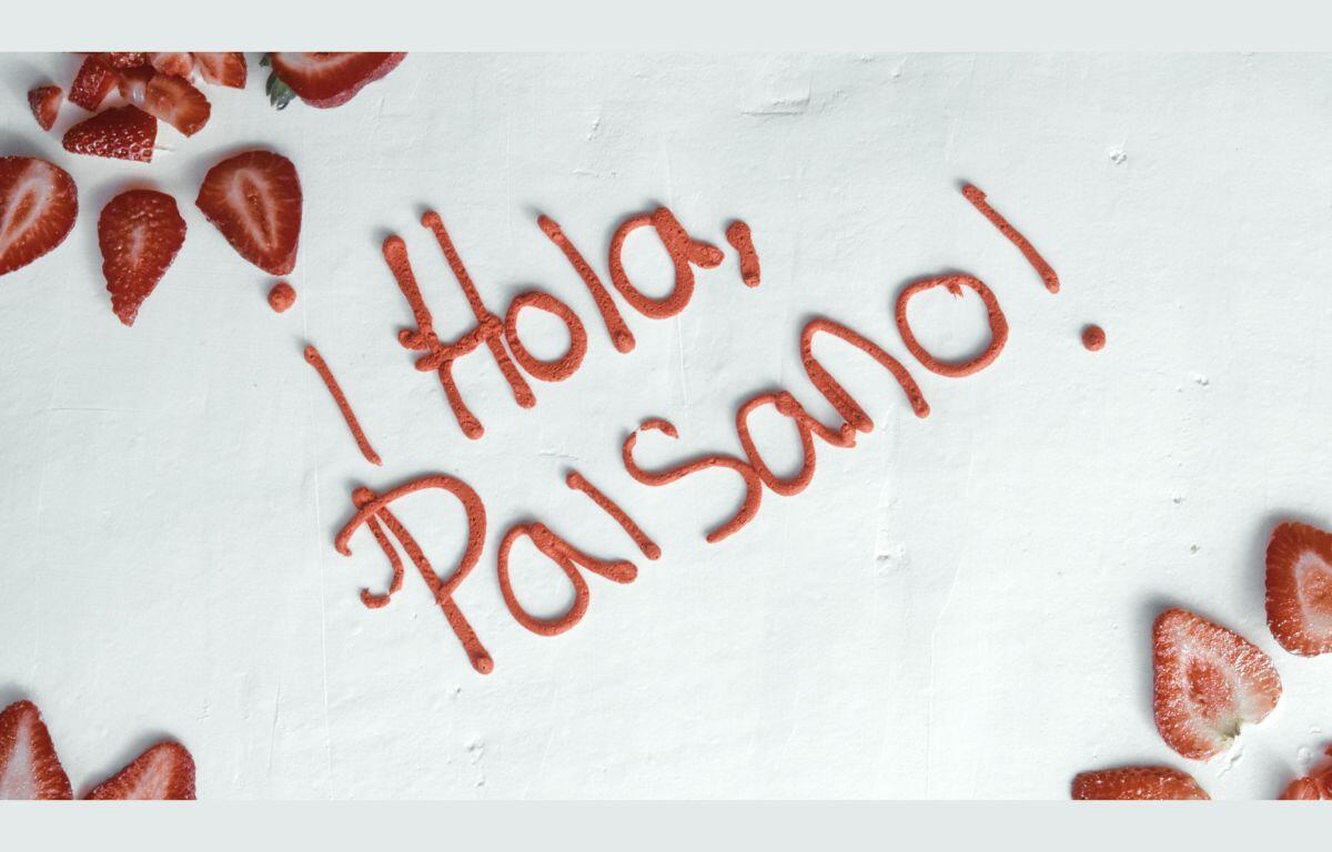 Hola Paisano title in icing on the cake