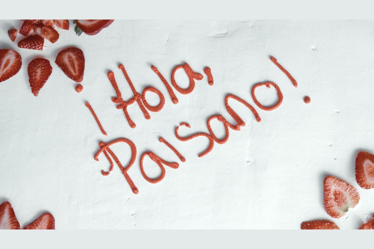 Hola Paisano title in icing on the cake