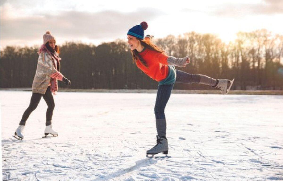 Two women ice skating