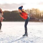 Two women ice skating