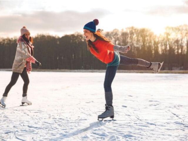 Two women ice skating