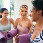 Women talking at a yoga class