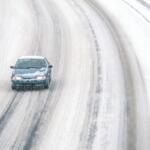 Car on snowy road.