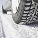 Up close of car tires on a snowy road