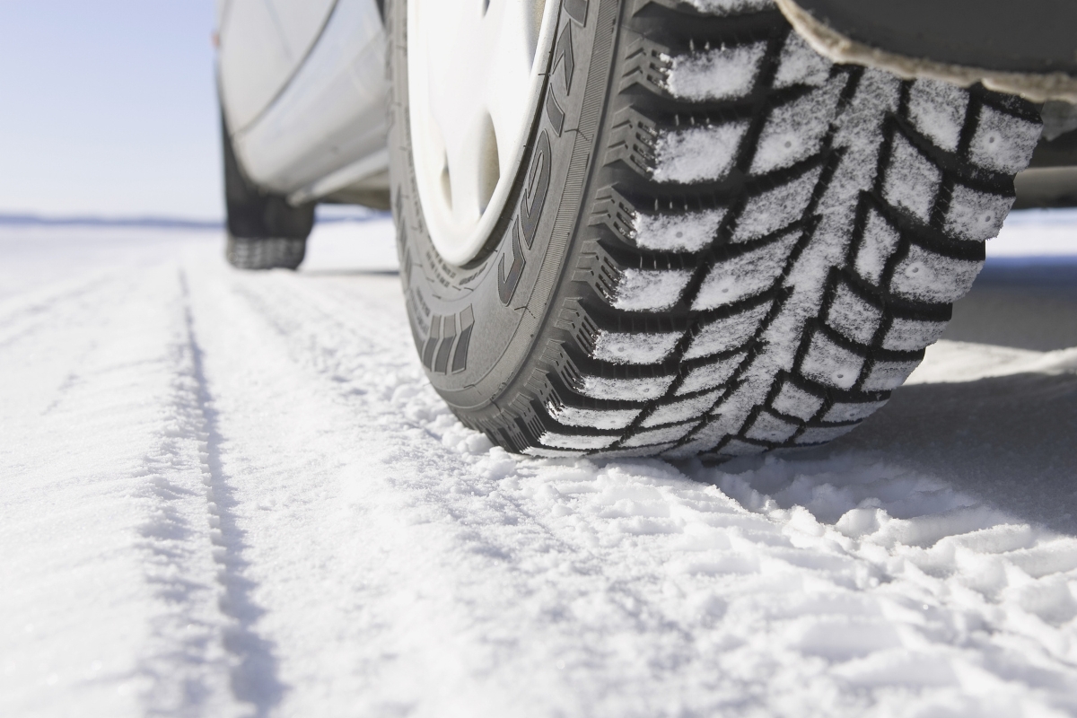 Up close of car tires on a snowy road