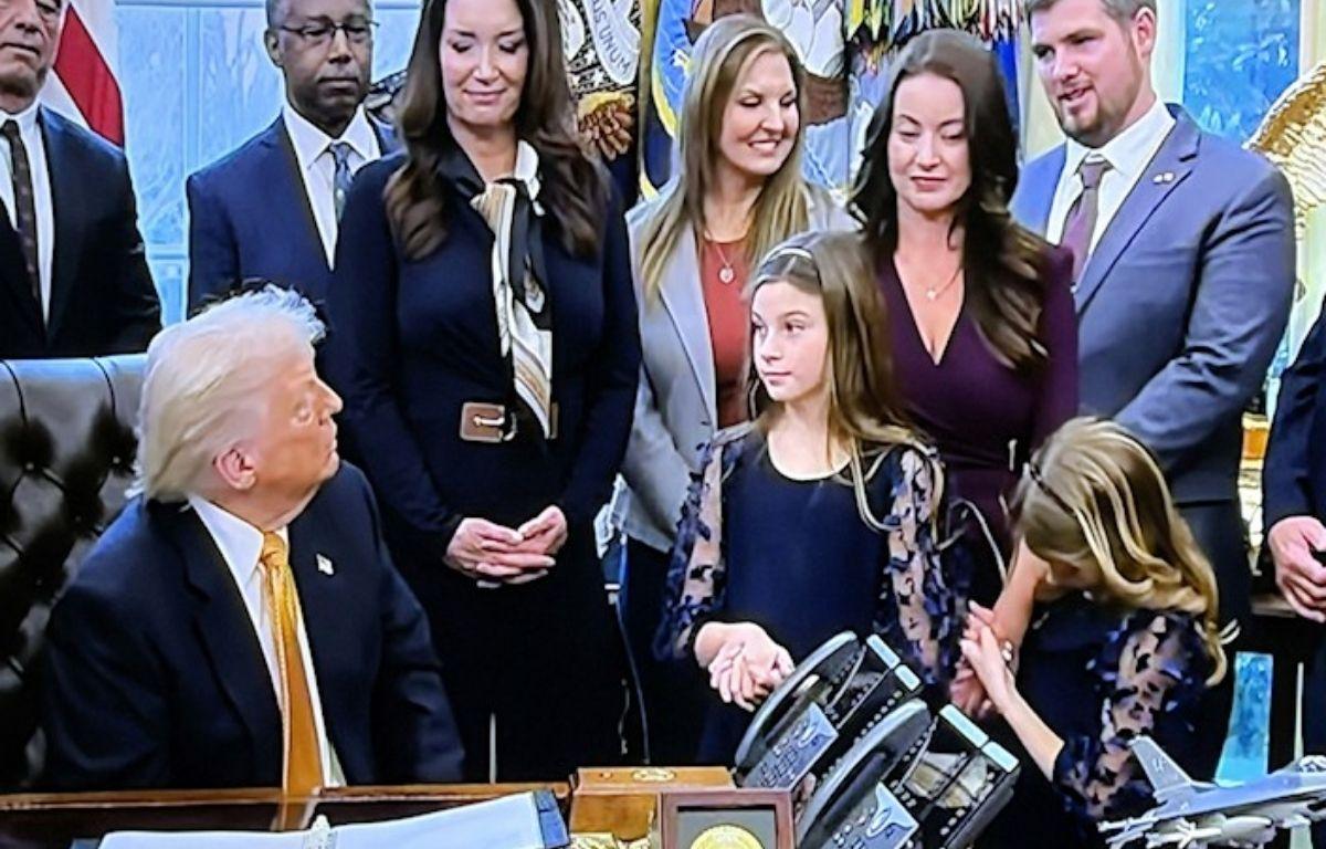 Shenandoah County dairy farmer Thomas French (upper right) chats with President Trump during the signing ceremony.