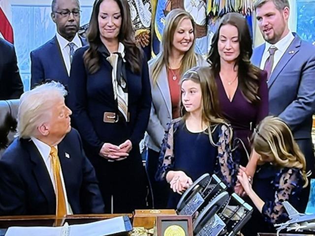 Shenandoah County dairy farmer Thomas French (upper right) chats with President Trump during the signing ceremony.