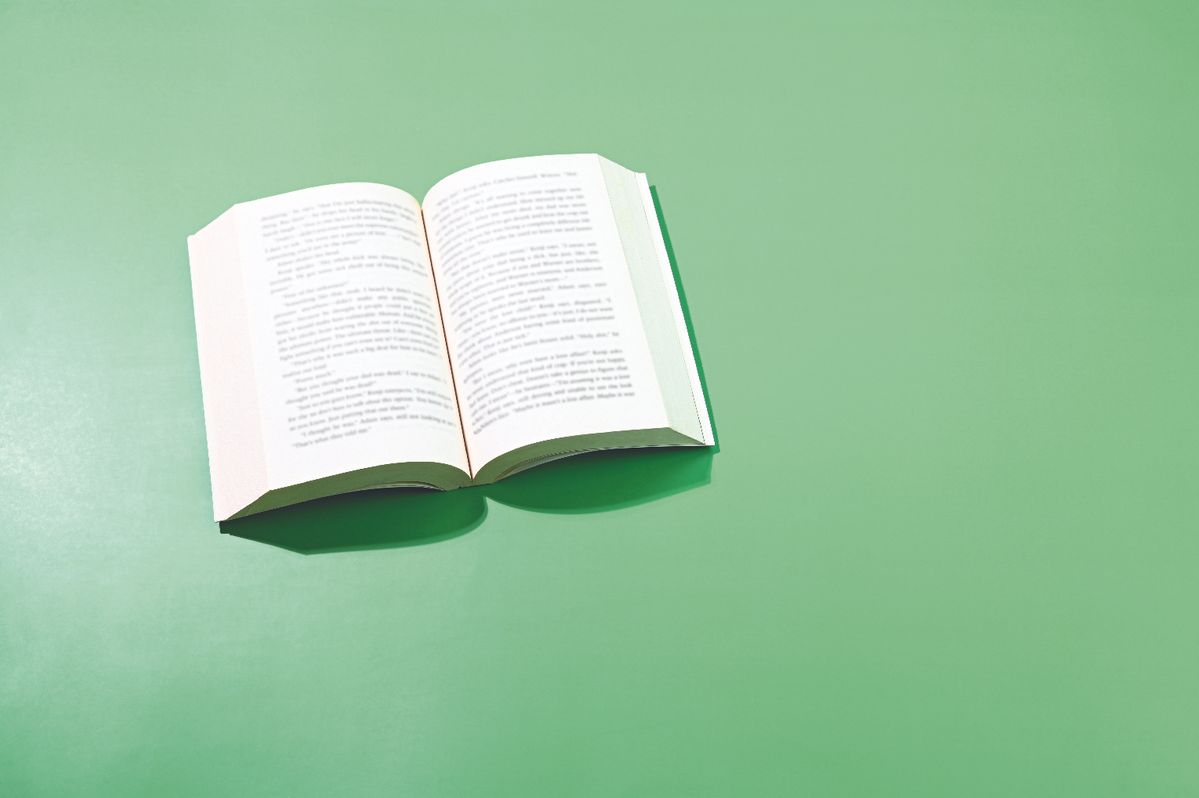 Open book on green background