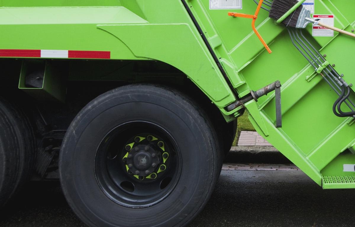 Up close of a trash truck's tires.