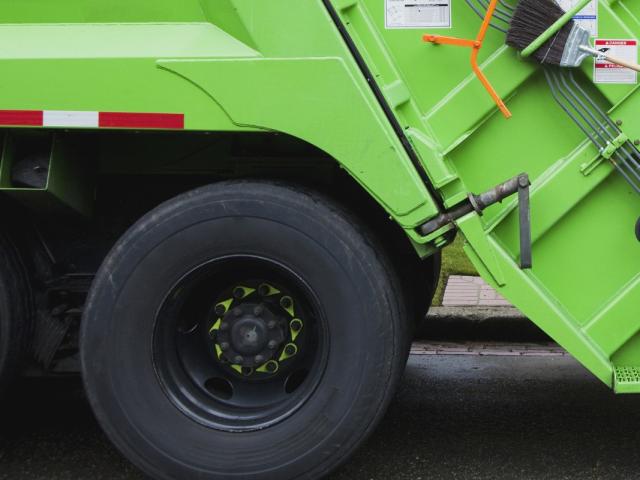 Up close of a trash truck's tires.