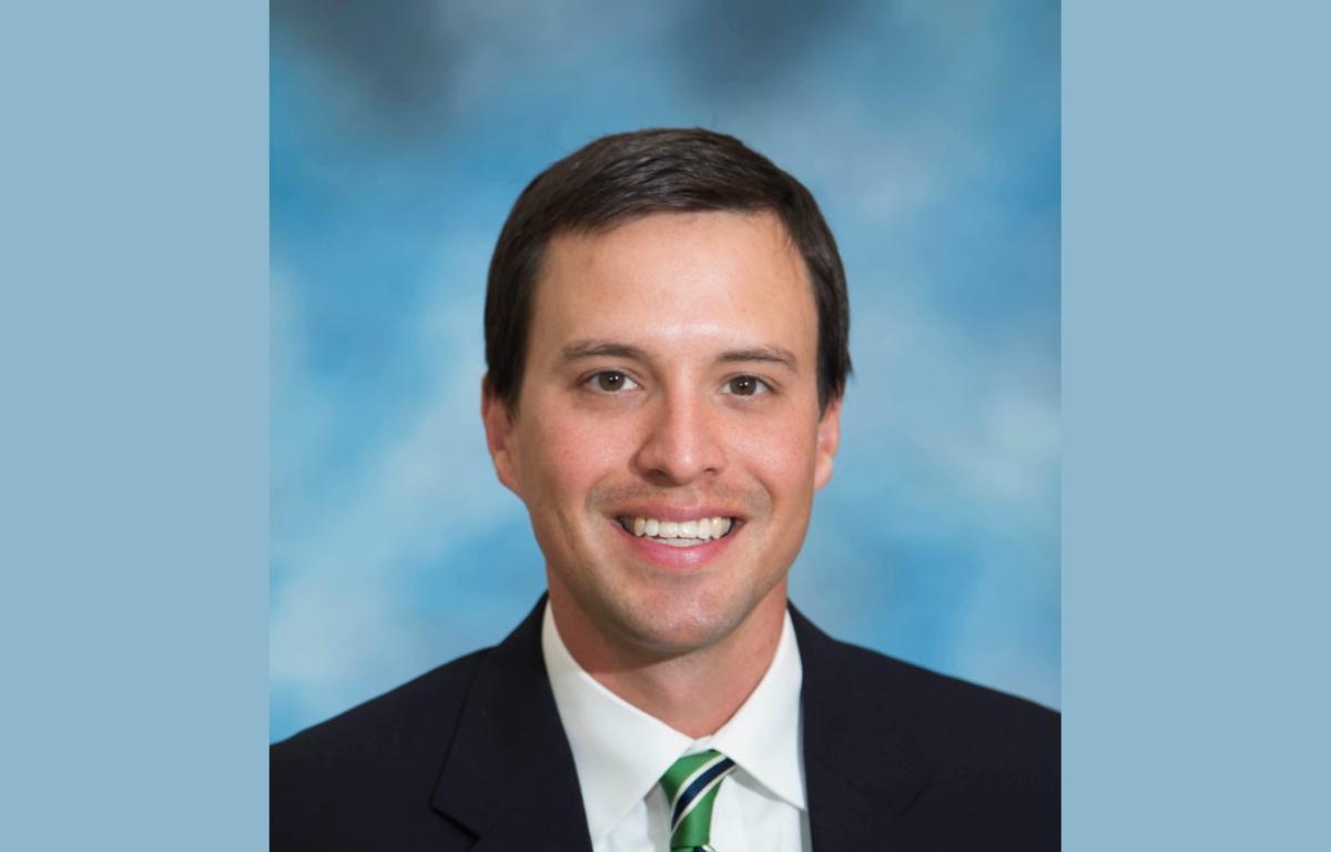 Headshot of Dr. Derek Robinson.