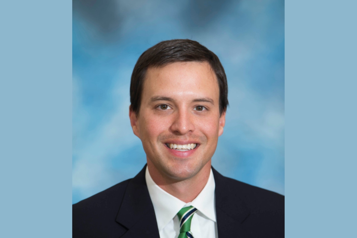 Headshot of Dr. Derek Robinson.