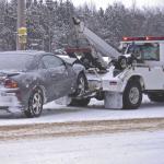 A car getting towed in snow