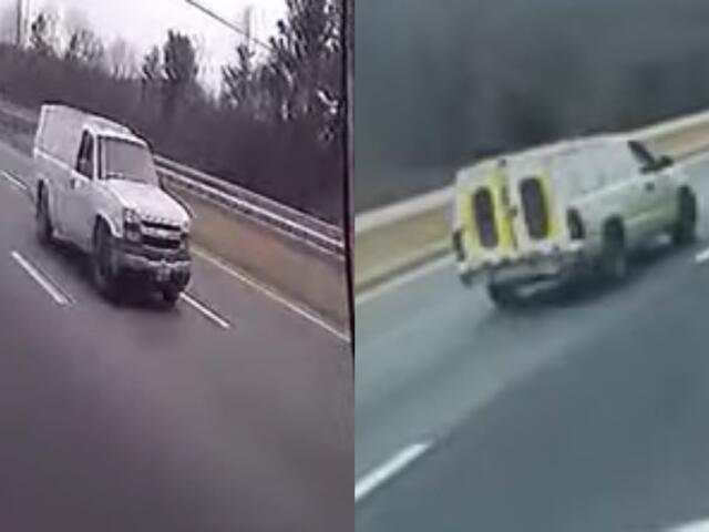 A white pickup truck with a shell on the back.