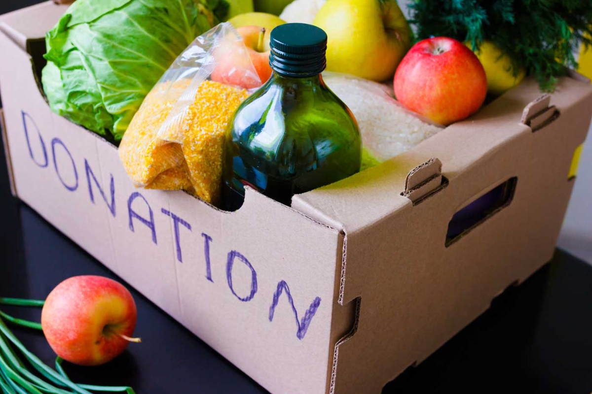 Produce in a donation box on a table.