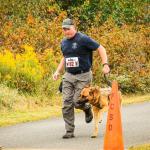 Tyr running with his handler.