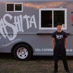 Chef Mikey Reisenberg stands beside the Mashita food truck.