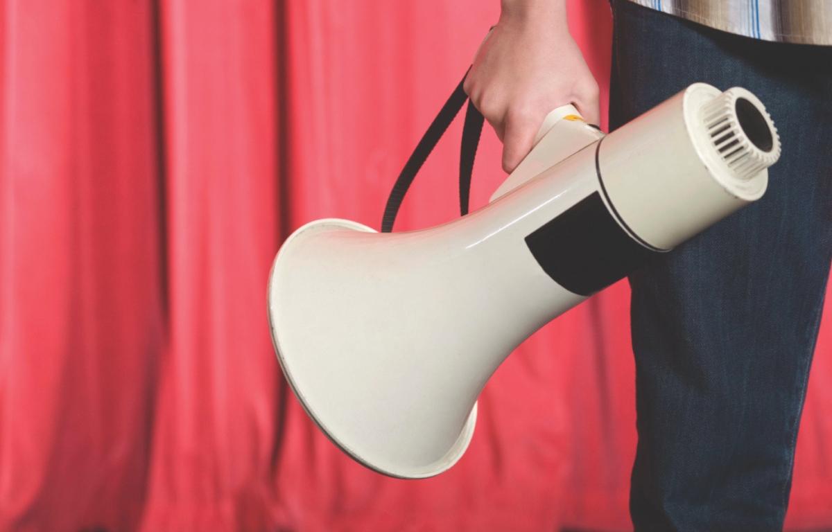 A person holding a megaphone.
